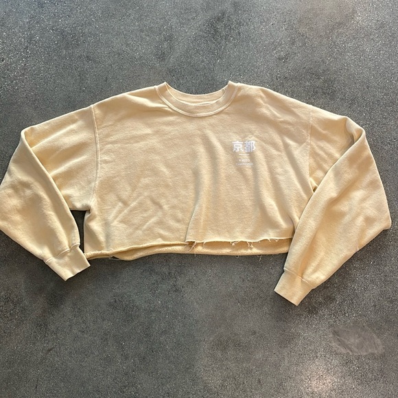 Urban Outfitters cropped graphic sweatshirt. Pale yellow. Kyoto Champions - Picture 1 of 3